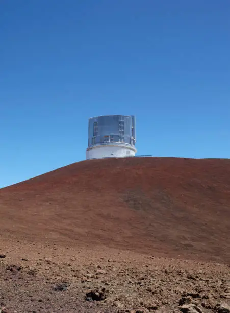 Observatory with clear blue sky and volcanic landscape