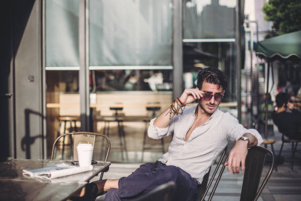 istock Attrective man sitting in coffee shop 840593272