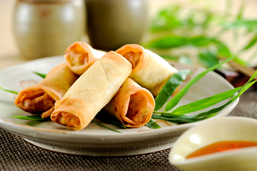 Fried chinese spring rolls with sweet chili sauce.Fried chinese spring rolls with sweet chili sauce.