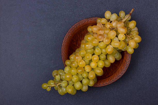 istock Bowl with a bunch of white grapes 840599602