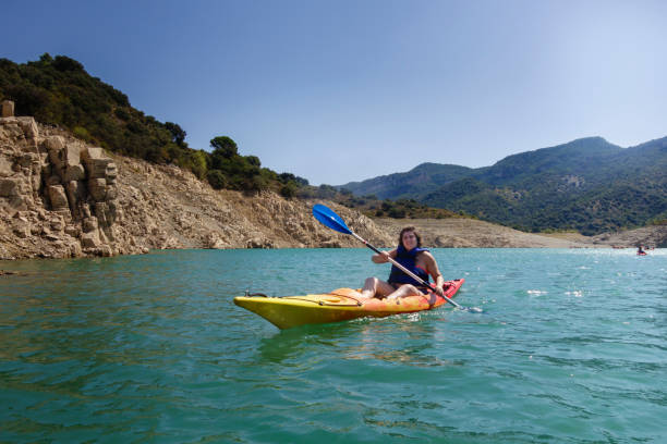 istock Young woman rowing in a kayak 840603024
