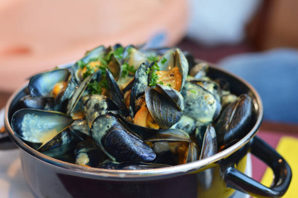 istock Mussel in a casserole with sauce curry 840607478