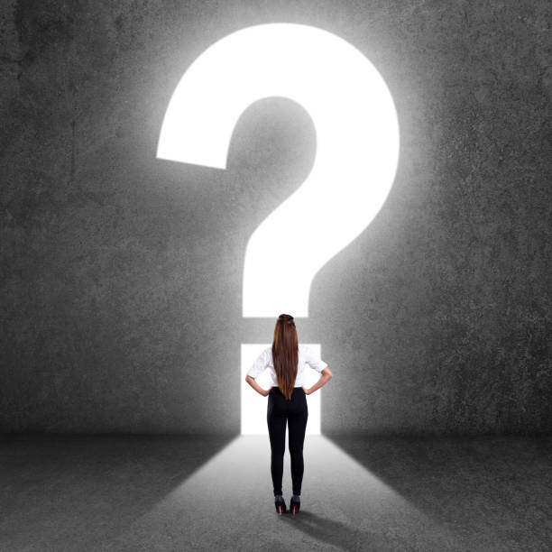 istock Businesswoman looking at question mark 840609878
