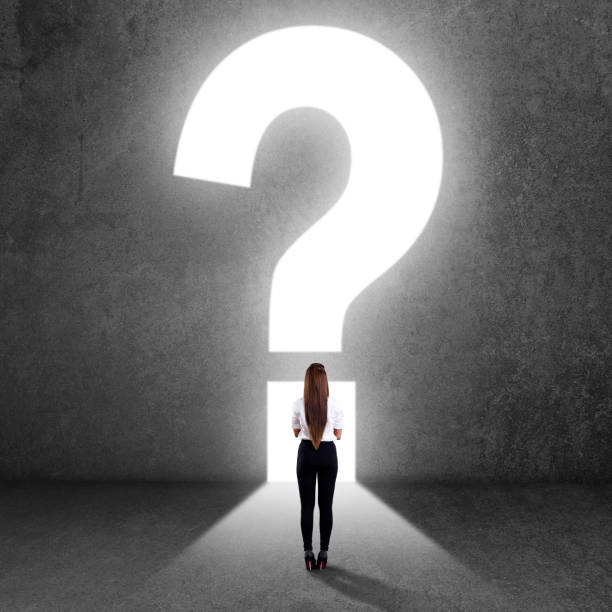 istock Businesswoman looking at question mark 840609948
