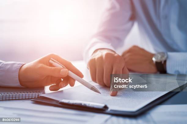 Business People Negotiating A Contract Stock Photo - Download Image Now - Contract, Insurance, Insurance Agent