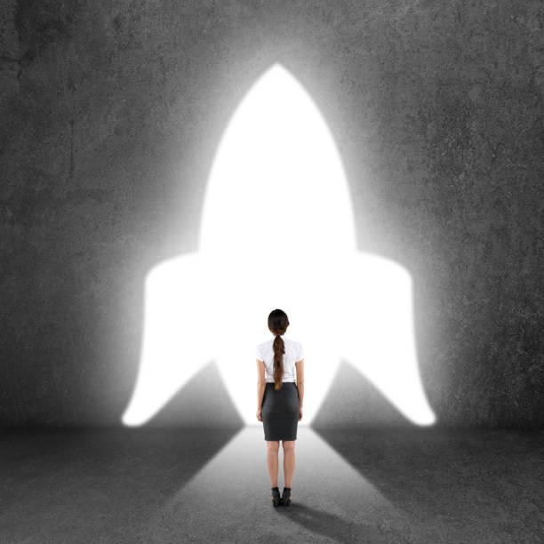 Rear view of businesswoman on the way to start up launch