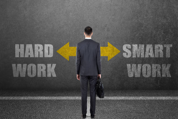 istock Businessman with hard work or smart work choice on wall 840610662