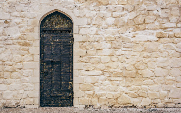 Stone Wall with Door and Oriental Engraving.