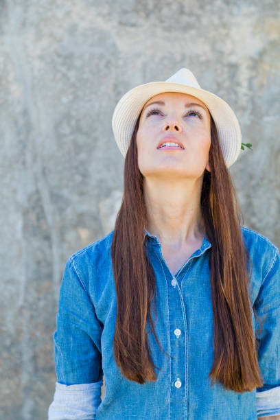 istock Young woman looking up with confidence 840619732