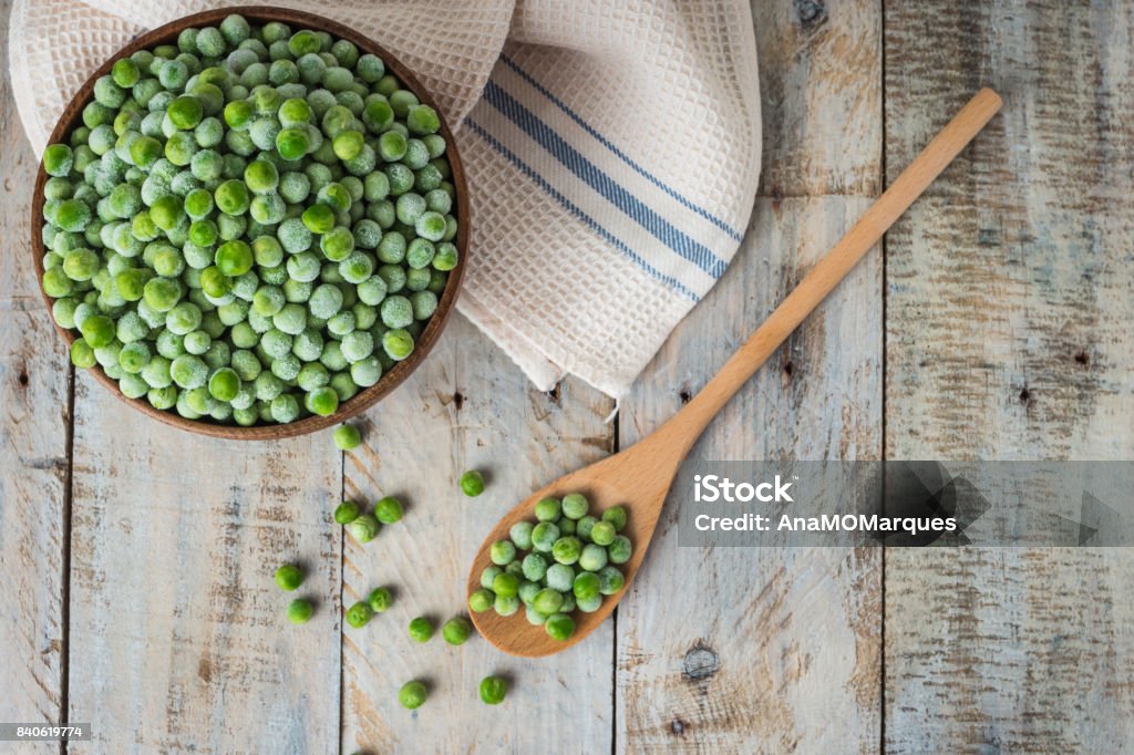 Fresh frozen peas. Fresh frozen peas. Vegetable food background healthy vegetarian natural meal. Green Pea Stock Photo
