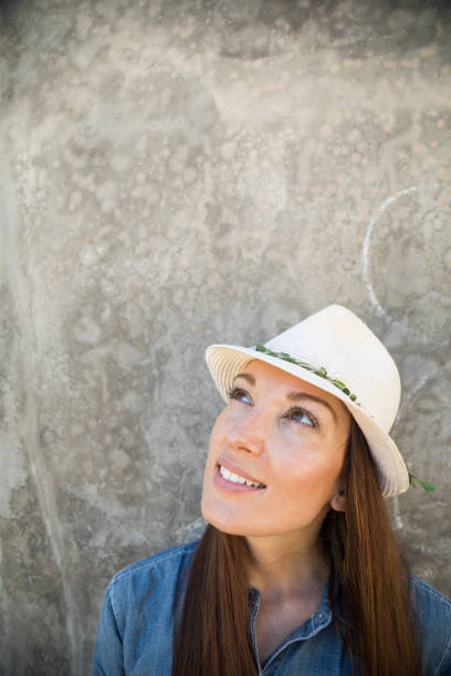 Young woman looking up with confidence