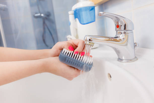 istock Woman washing her hands in sink 840622180