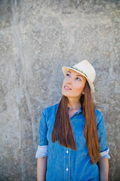 istock Young woman looking up with confidence 840627756