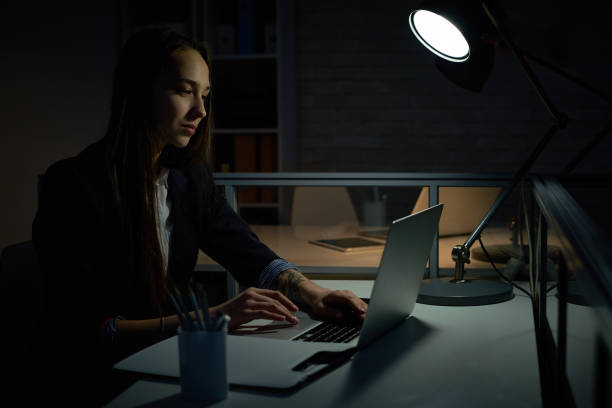 istock Busy creative employee in dark office 840632280