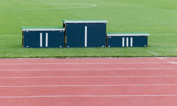 istock Athletics podium on grass in the stadium 840632818