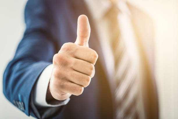 istock Business man shows thumb up sign gesture. 840632842