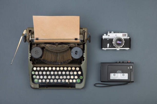 istock Journalist and writer desktop - typewriter, tape recorder and notepad, top view 840635510