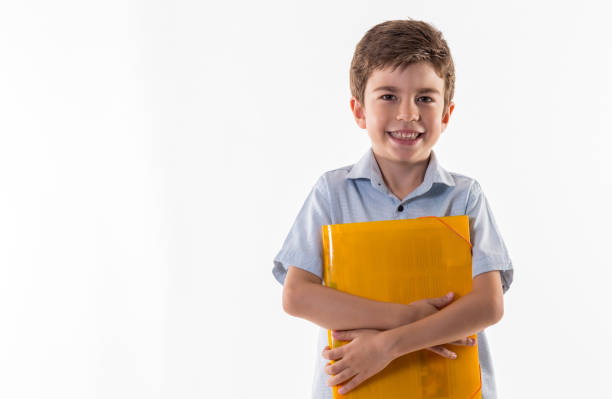 istock Happy little schoolboy standing isolated on white background 840636180