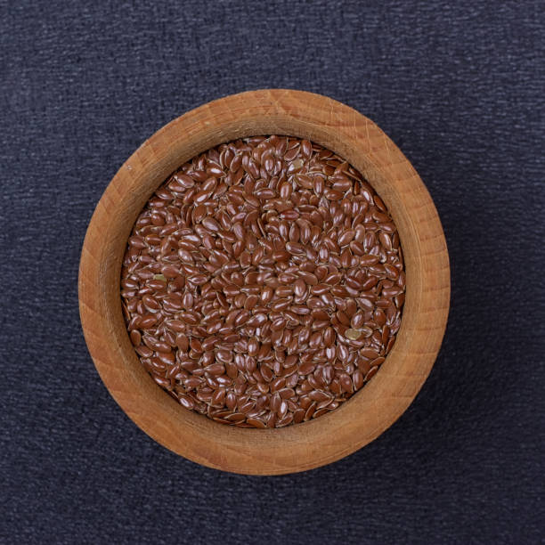 istock Flax seed in a wooden bowl 840636478
