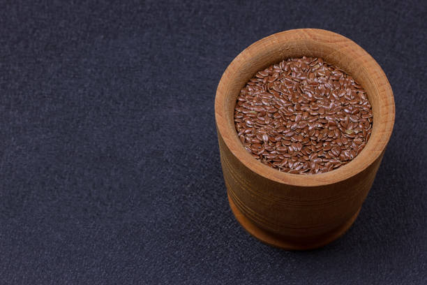 istock Flax seed in a wooden bowl 840636616