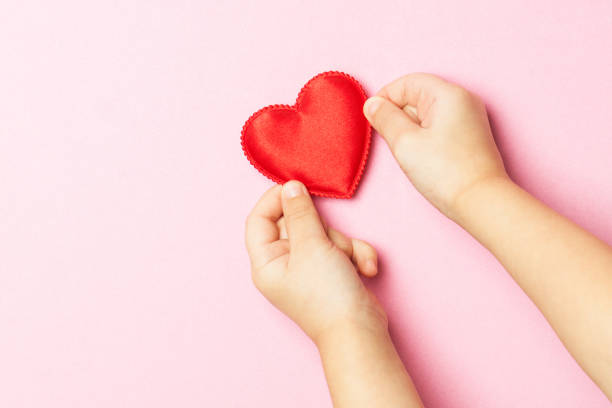 istock Children's hand and heart 840639444