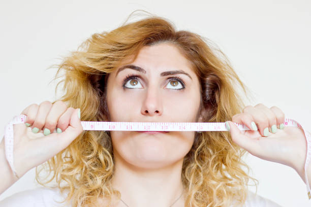 istock Tape measure on white background 840640224
