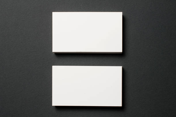 istock Blank business cards on dark textured background 840644246