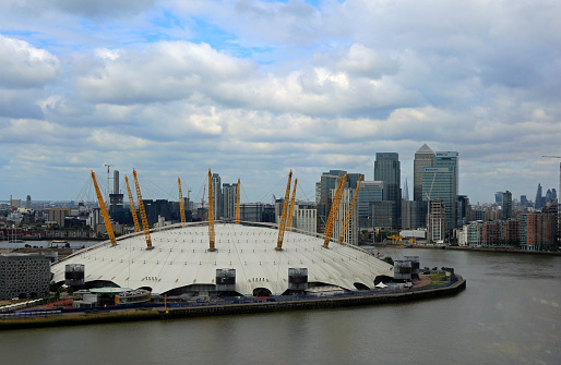 The 02 Arena is based on the bank of the River Thames in Greenwich.  There are panoromic views of Canary Wharf and It is a large venue which hosts many different shows and concerts.  London, Greenwich, England, 2015
