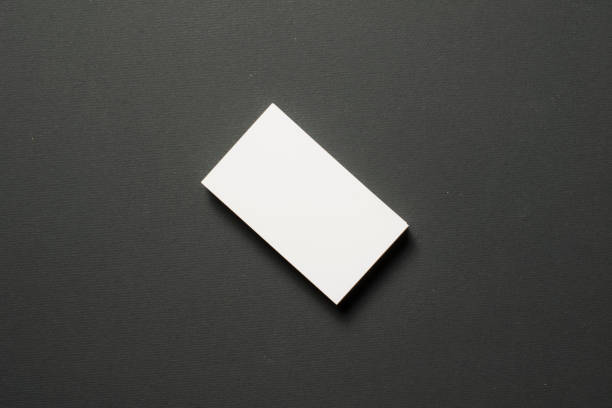 istock Blank business cards on dark textured background 840646856