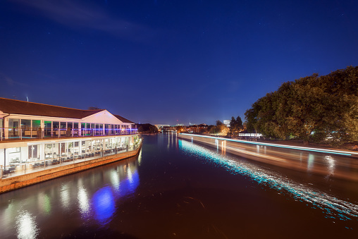 The River Thames in Reading, UK at night on a warm summer's evening.