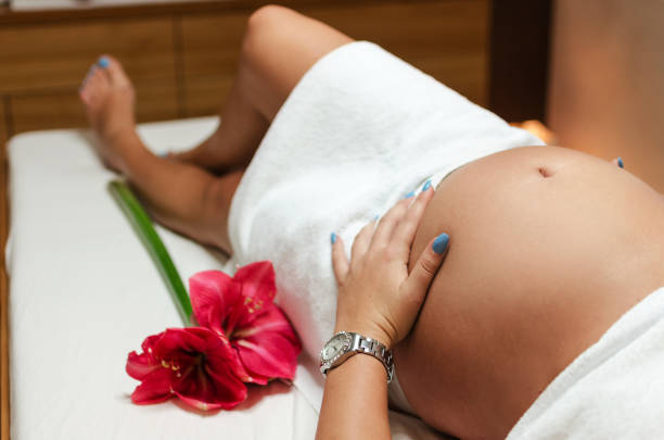 istock Pregnant woman keeps her baby 840647398