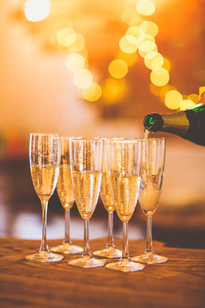 istock Champagne glasses on gold background. Party concept 840650430