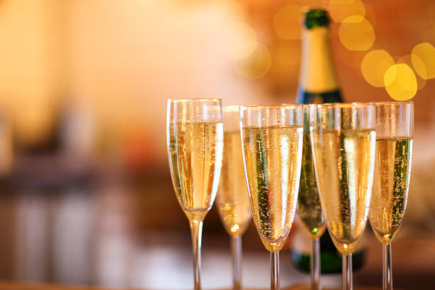 istock Champagne glasses on gold background. Party concept 840650760