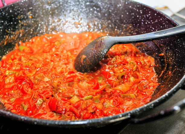 istock Fried tomato ready to ad to Paella 840651008