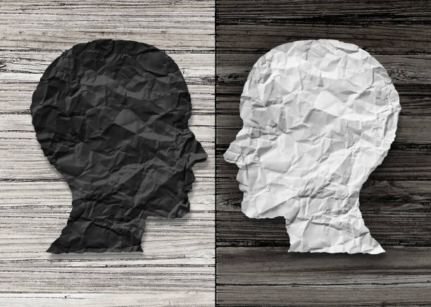 Bipolar Mental Health Bipolar mental health and brain disorder concept as a human head in paper divided in two colors as a neurological mood and emotion symbol or medical psychological metaphor for social behavior challenges in a 3D illustration style. bipolar disorder stock pictures, royalty-free photos & images