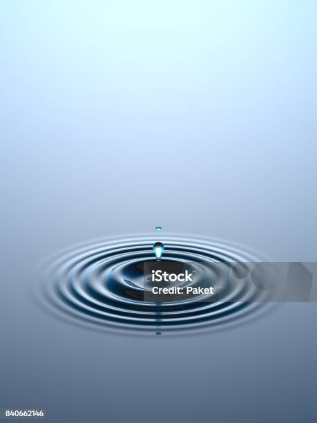 Water Drop Falling Into Water Surface Stock Photo - Download Image Now - Water, Rippled, Drop
