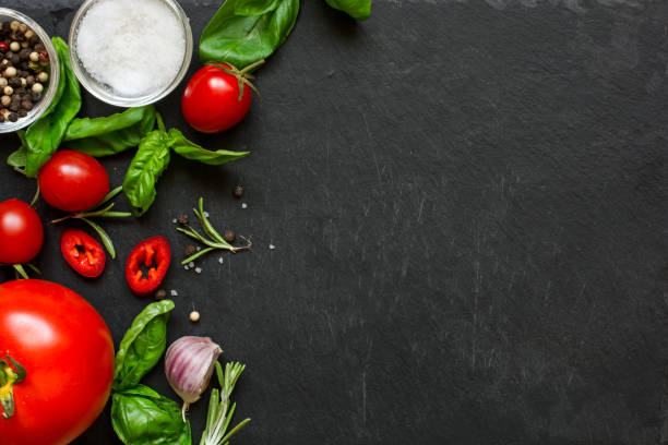 istock concept cook work with vegetables, spices and herbs on dark background. 840666464