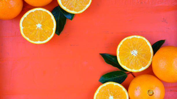 Oranges on orange wood table Oranges on orange wood table overhead, with copy space. navel orange photos stock pictures, royalty-free photos & images