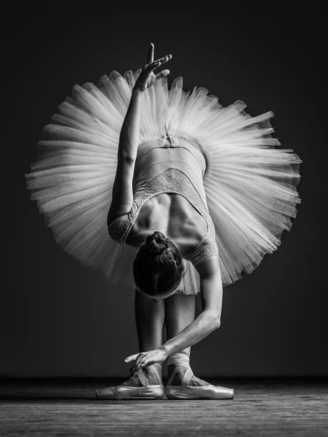 istock Young beautiful ballerina posing in studio 840674858