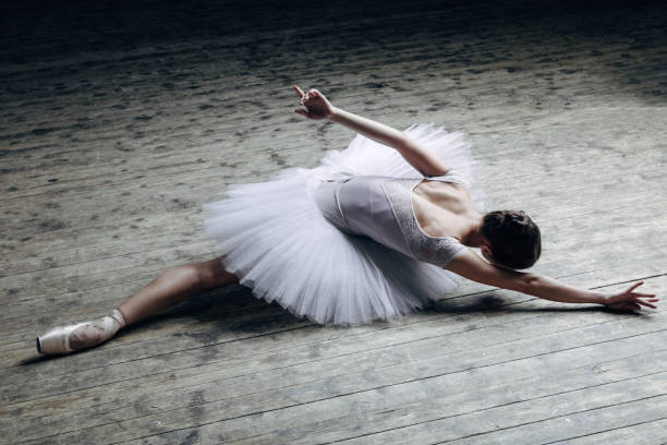 istock Young beautiful ballerina posing in studio 840675074