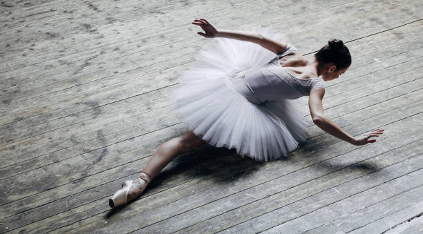 istock Young beautiful ballerina posing in studio 840675440