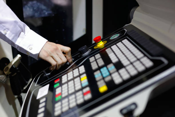 istock operator controls the operation of the CNC machine 840678434