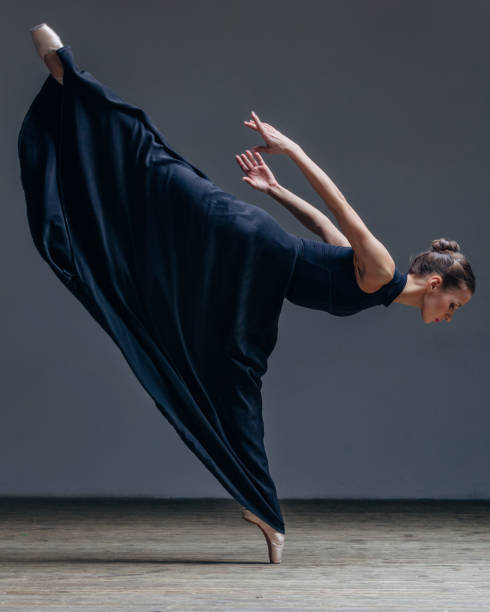 istock Young beautiful ballerina posing in studio 840679564