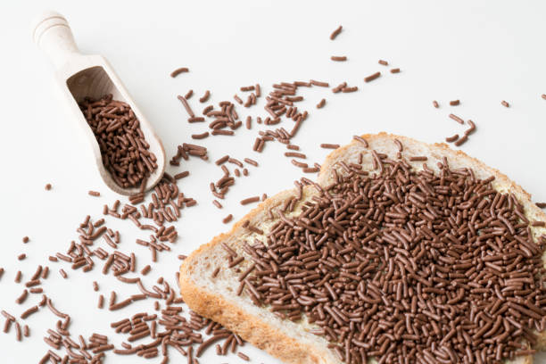 istock slice of brown bread chocolate hail, hagelslag on white table 840682546