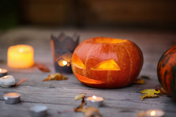 istock Halloween pumpkins head jack o'lanterns with candles 840683984