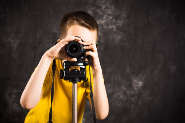 istock Young photographer with camera on a tripod 840685586