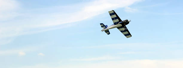 istock Radio controlled toy airplane against blue sky with white clouds 840685926