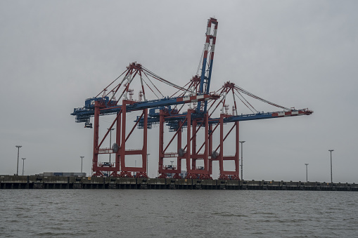 Crane to discharge containers from vessels at the German port Wilhelmshaven.