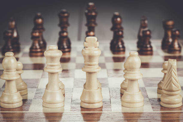 istock chess board with figures on the wooden table 840692070