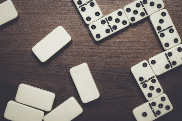 istock domino pieces on the wooden table background 840692582